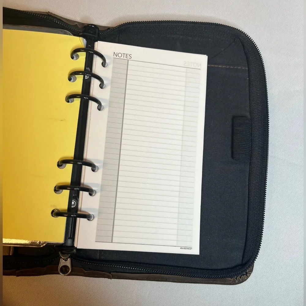 Day Timer Brown Folder With Some Papers